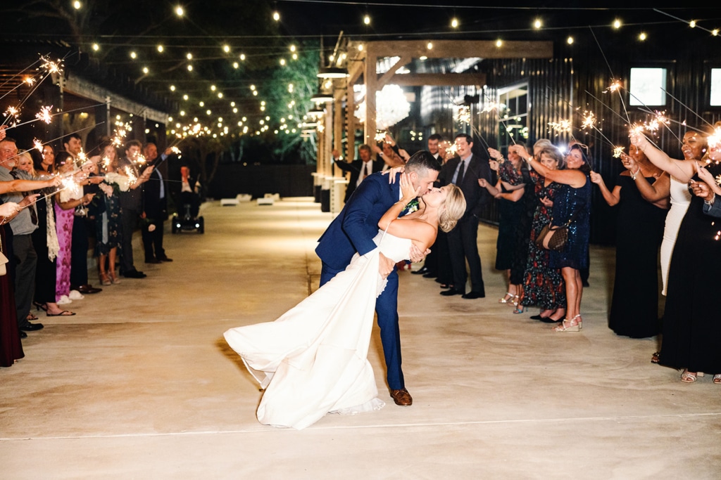 Groom Kissing Bride at the Stables on the Brazos, Fulshear, Texas